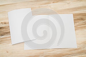 Bifold white template paper on wood