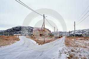 Bifurcation of the road. Old authentic village of Teriberka