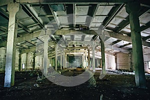 Big abandoned industrial warehouse interior inside, perspective