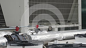 Big air ventilation HVAC units for office building with pipes and manometers