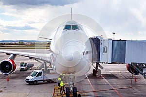 Big airliner close-up at airport on the service prior to departure