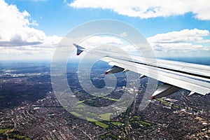 Big airplane begins to decline and prepares for landing in Heathrow Airport . London. UK