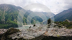 Big Almaty lake in the mountains. Green hill.