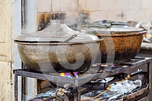 Big aluminium pots on a gaz stove