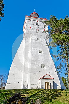 Big ancient tall white lighthouse in Kopu