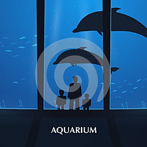 Big Aquarium or Dolphinarium With dolphin. People with children watching the underwater world.