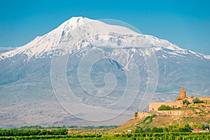Big Ararat with a snow-capped peak and the monastery of Khor Virap, a tourist attraction