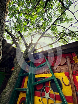 Big ax on a colored wall with horseshoes