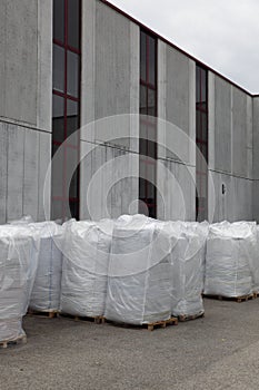 Big bags beside industry hall