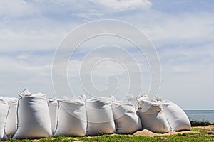 Big bags of sea sand on the beach.