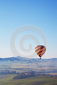 Big balloon flies over rural houses