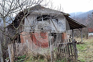 Big barn with red bricks and wooden wall on the village