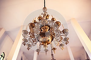 Big beautiful bronze chandelier in an orthodox church