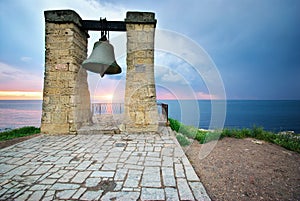 Big bell on sea shore