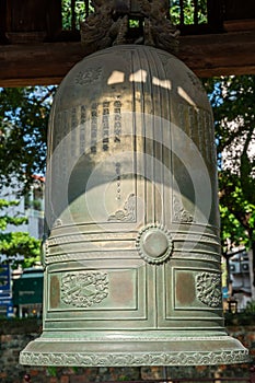 Big bell on side of Imperial Academy in Temple of Literature Van Mieu, the first national university in Hanoi