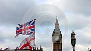 Big Ben with British flags waving in London