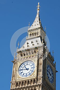 Big Ben clock tower close up in London on the blue sky. Symbol of London, United Kingdom.