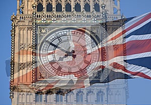 Big Ben, Clock Tower, Parliament House and British Flag merged in a double exposure shot of flag and historic London Building