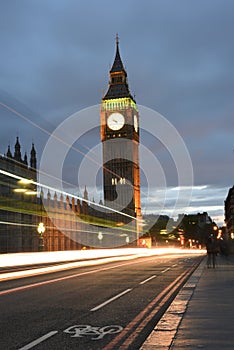 Big Ben or Great Clock Tower or Palace of Westminster or UK Parliament at night hours with light trails of buses, cars