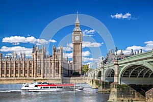 Big Ben and Houses of Parliament with boat in London, England, UK