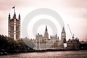 Big Ben and Houses of Parliament in dark colors, London, UK.