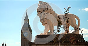 Big Ben, Houses of Parliament and the Lion Statue on Westminster Bridge, London, England