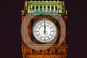 Big Ben of the Houses of Parliament London England UK at night striking midnight on new year`s eve