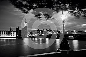 Big Ben, London the UK at sunset. Retro street lamp light on Westminster Bridge. Black and white