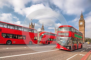 Big Ben with red buses in London, England, UK