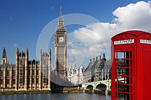 Big Ben with red phone booth in London, England