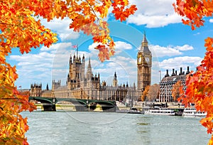 Big Ben tower with Houses of Parliament and Westminster bridge in autumn, London, UK