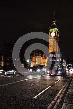 Big Ben Tower and red bus London, night time