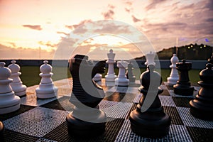 Big black horse chess decorated on roof top at sunset