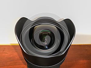 Big black wide angle zoom camera lens Sigma Art 14-24mm DG HSM with built in lens hood and