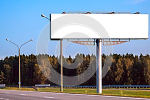 Big blank billboard mock-up along highway against  forest