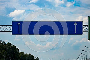 Big blank highway road sign with gradient blue sky