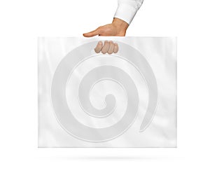 Big blank plastic bag mock up holding in hand. Large empty polyethylene package