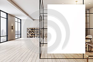 Big blank white poster on cabinet glass wall in modern open space office with wooden decoration elements, floor and big window.