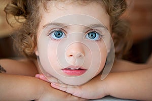 Big blue eyes toddler girl looking at camera