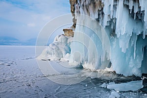 Big blue icicle hanging from a cliff.