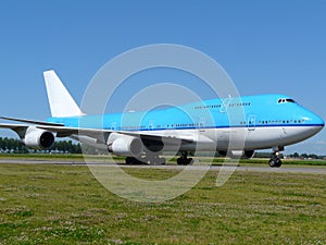 Big blue plane taxing photo