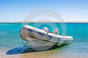 Big boat with a motor tied at the seashore in Egypt