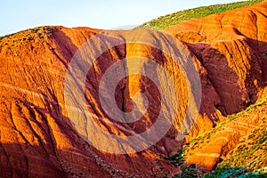 Big Bogdo mountain. Red sandstone outcrops on the slopes sacred mountain in Caspian steppe Bogdo - Baskunchak nature reserve,