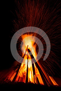 Big bonfire against dark night sky