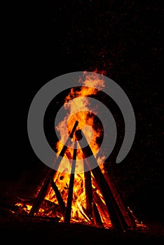 Big bonfire against dark night sky