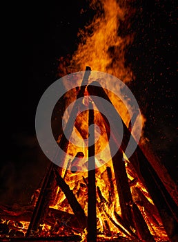 Big bonfire against dark night sky