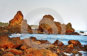 Big boulders being bathed by ocean water