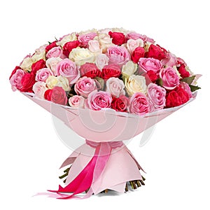 Big bouquet of pink, white and red roses in paper cone isolated on white background