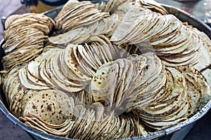 Big bowl of chapati - traditional Indian bread at the Golden Temple sri harmandir sahib in the Langar Kitchen