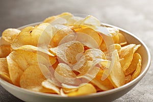 Big bowl of potato chips with crab taste on the table.